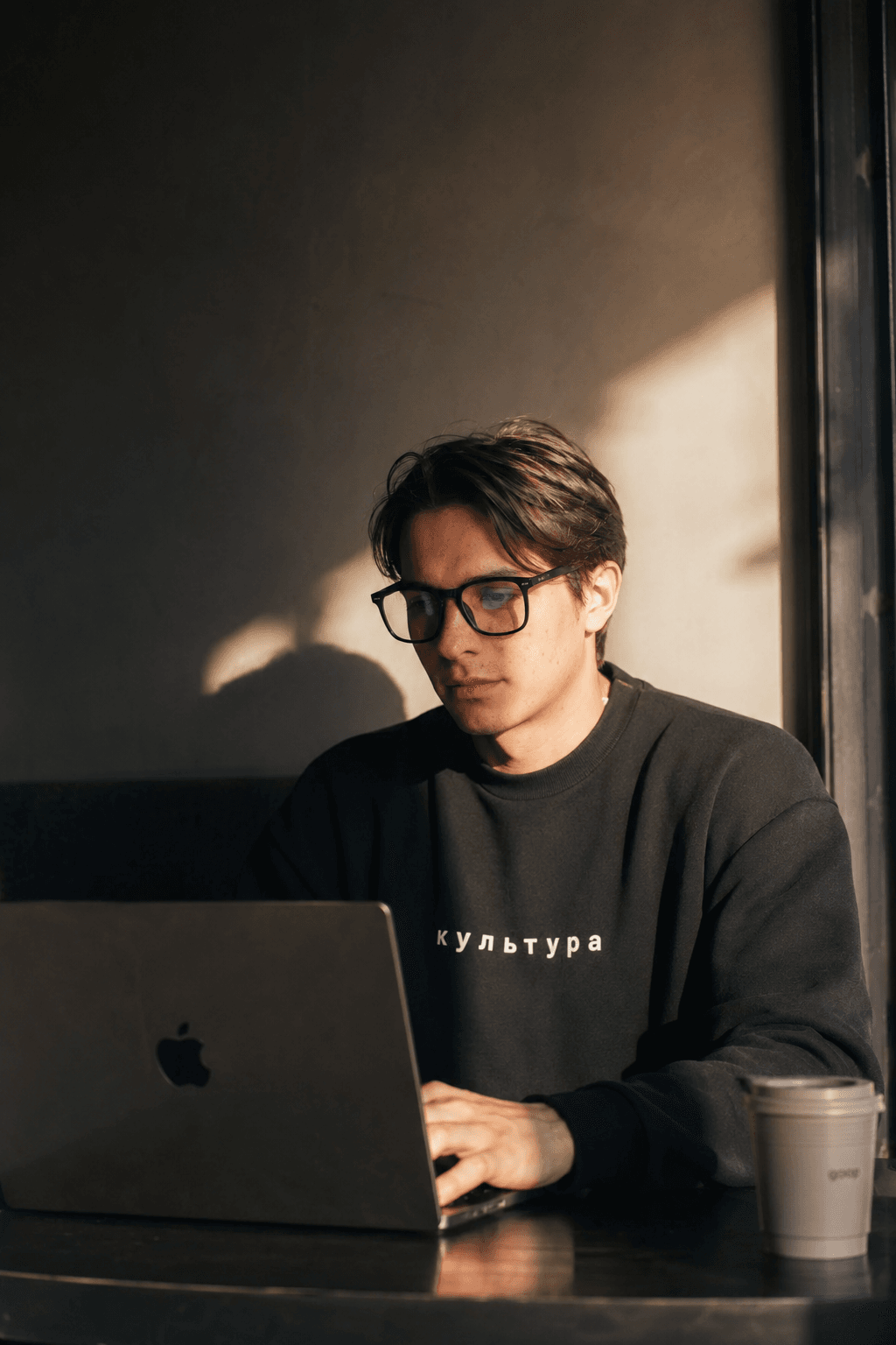 Ivan Voskres working at a laptop